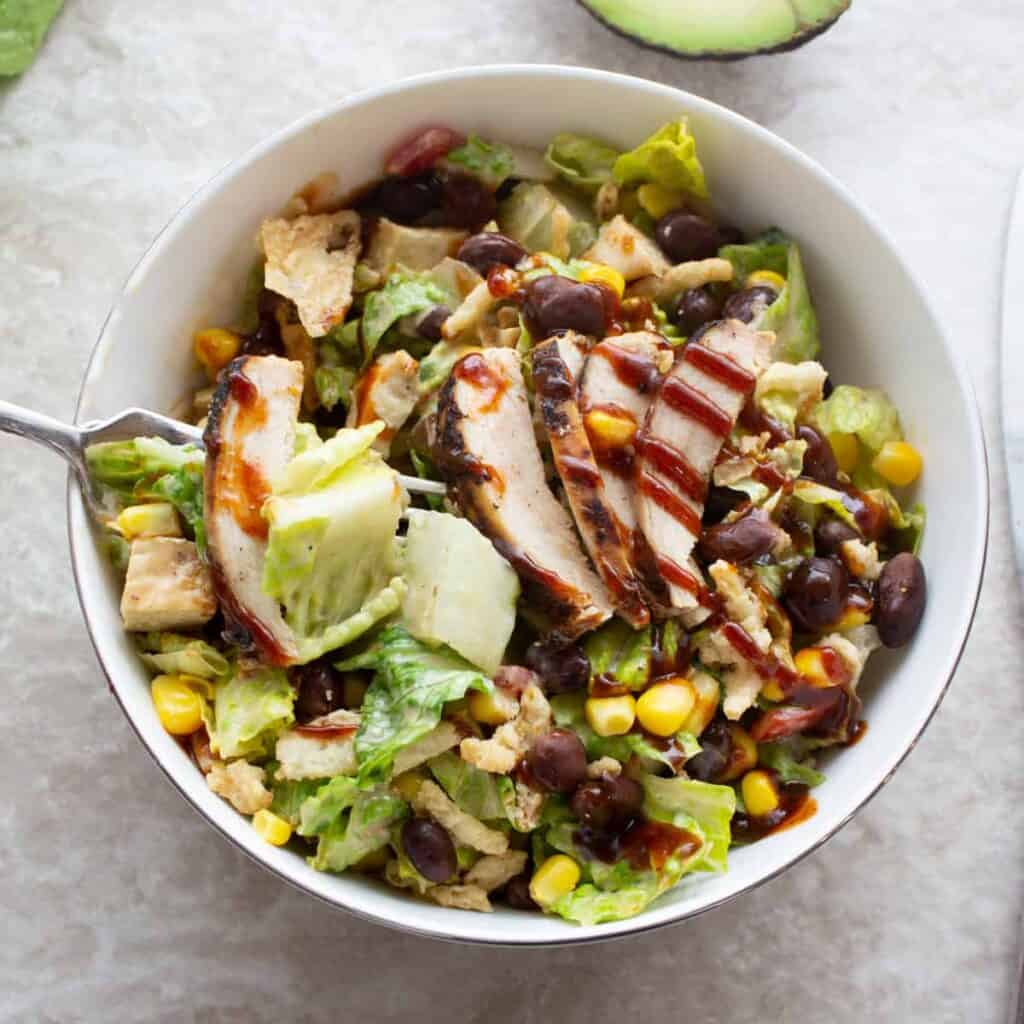 bbq chicken salad on a fork