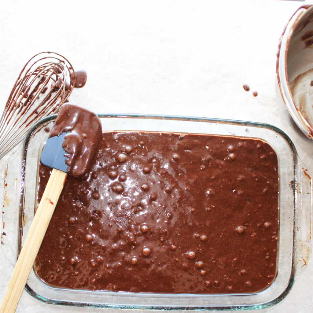 pour gluten free brownie batter into the pan