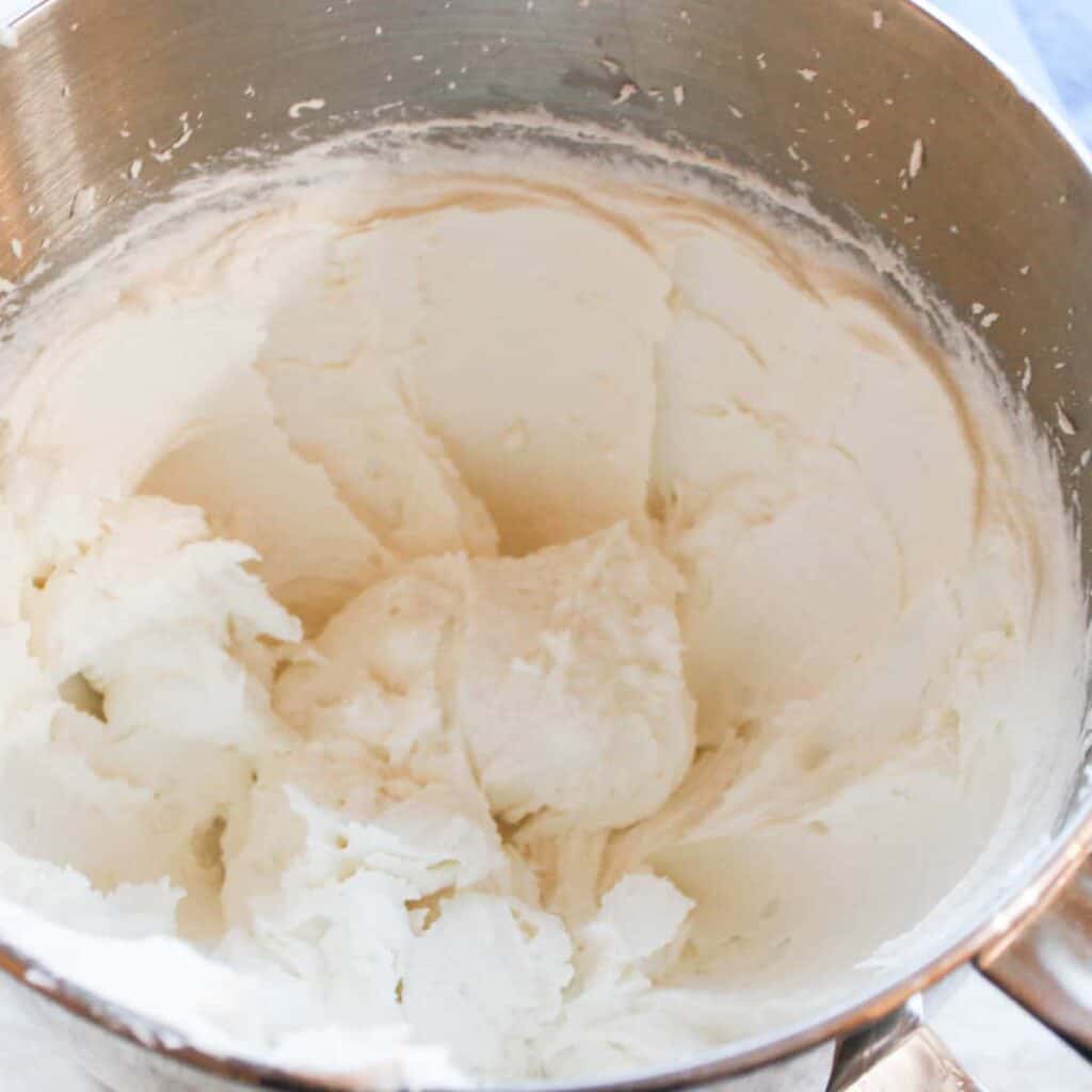 vanilla frosting in a mixing bowl
