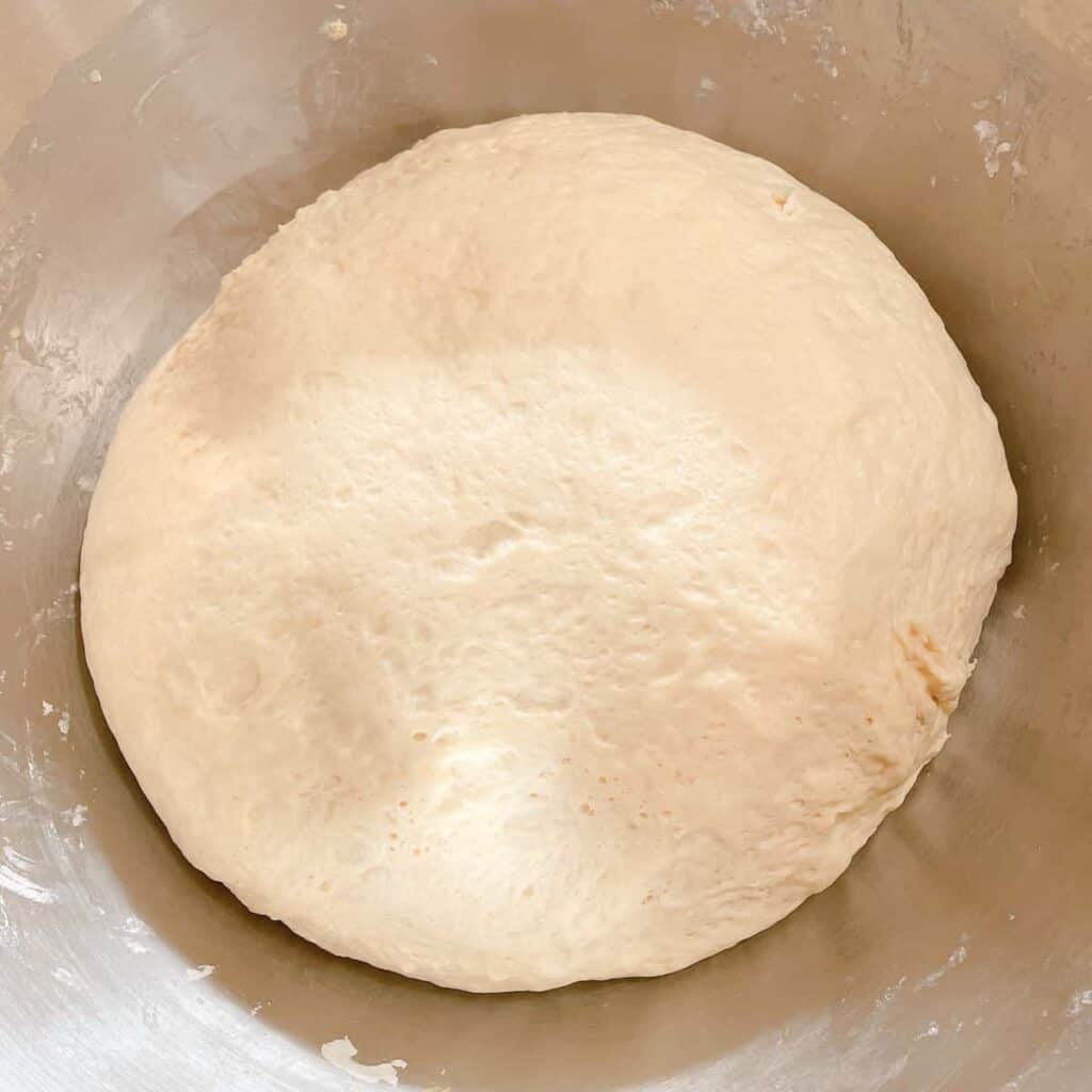 braided challah dough risen